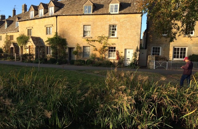 Period cottage in idyllic riverside location in prime Cotswolds village