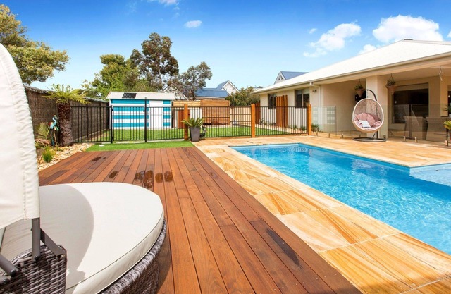 Pet friendly 4-bedroom Contemporary Coastal Oasis with Sparkling Blue Pool