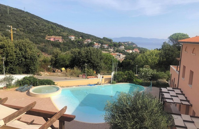 Pet-friendly Vacation Apartment La Pergola al Cavo 107 with Mountain View, Pool & Terrace