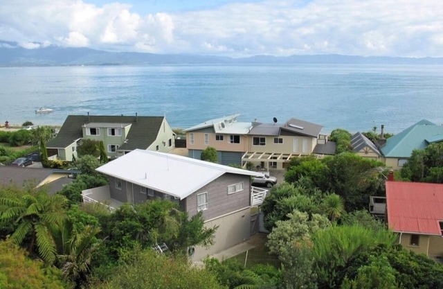 Pet friendly yard, great Sea Views and just across the road from Tata Beach