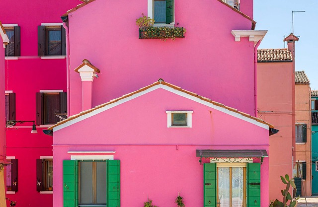 Pink artist's house on the edge of the lagoon, overlooking Torcello and the Alps.