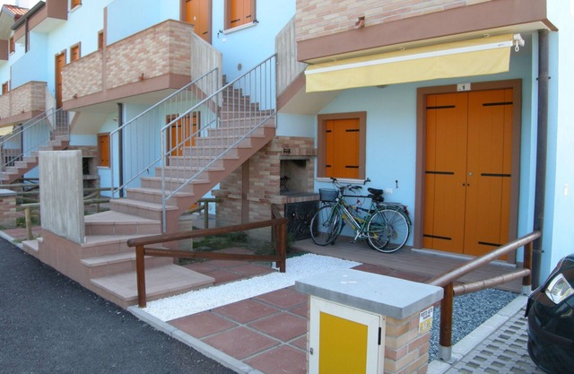 Poolside getaway seaside flat in Rosolina