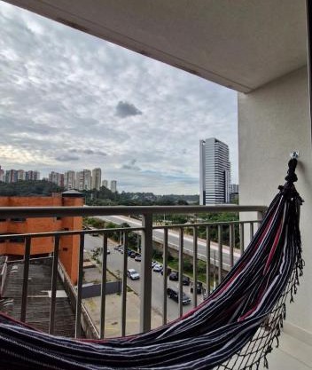 Por do sol desde uma rede na varanda da zona sul