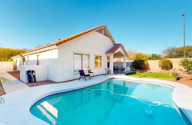 Power Ranch home with private pool, outdoor areas & a park across the street