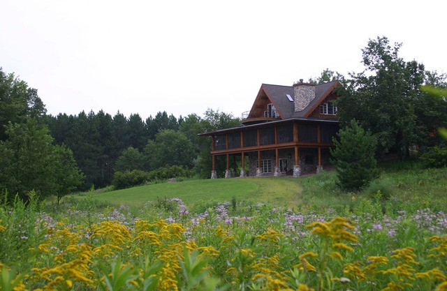 Premium log home on 600+ private wooded acres with private lake and waterfront
