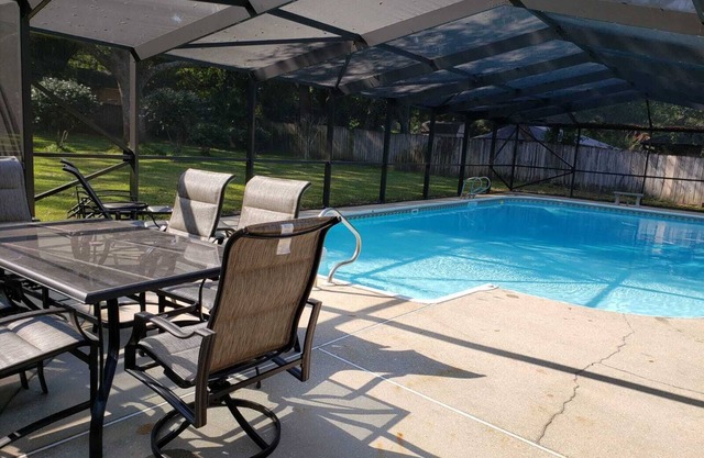 Private Getaway with Screened Pool, Upscale Kitchen, & Large Private Fenced Yard