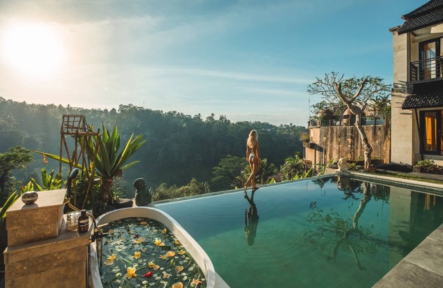 Private villa that offers a view of Mount Agung and lush jungle.