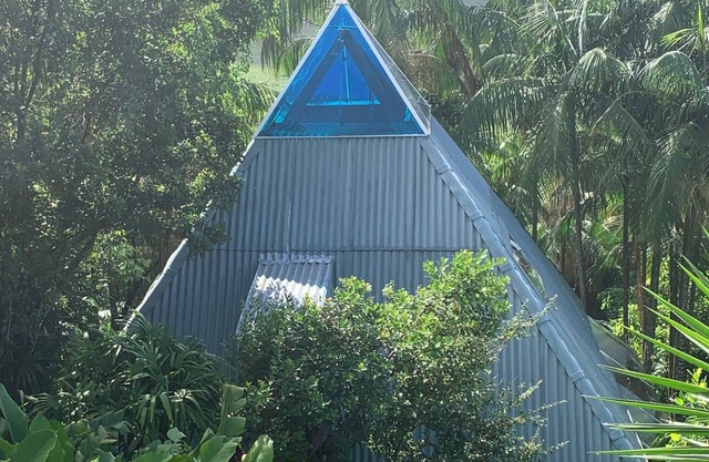 Pyramid house covered in quartz. Space for healing and regeneration connections.