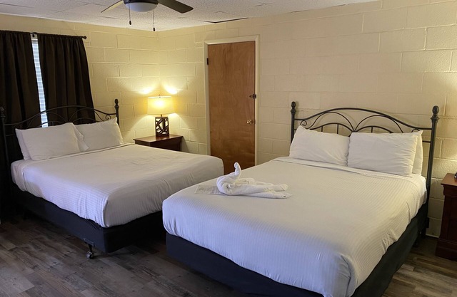 Queen Guest Room located at the Joplin Inn at the entrance to Mountain Harbor, , just 2 1/2 miles from Lake Ouachita. by RedAwning