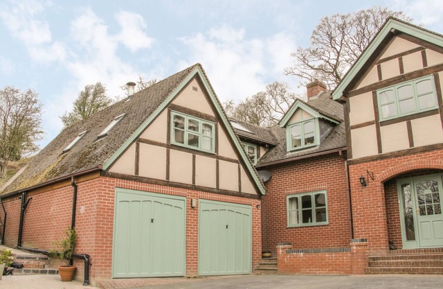 RAGLETH PLACE LODGE, pet friendly, with open fire in Church Stretton