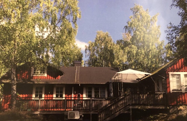 Red wooden house in Stockholm local resort