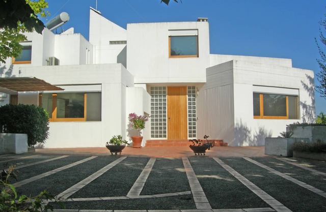 Refined modern architectural design villa in typical Apulian landscape.