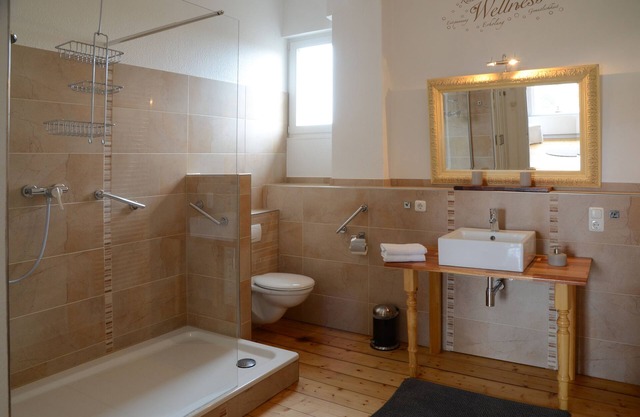 Refurbished old building including tiled stove, double doors and direct water view