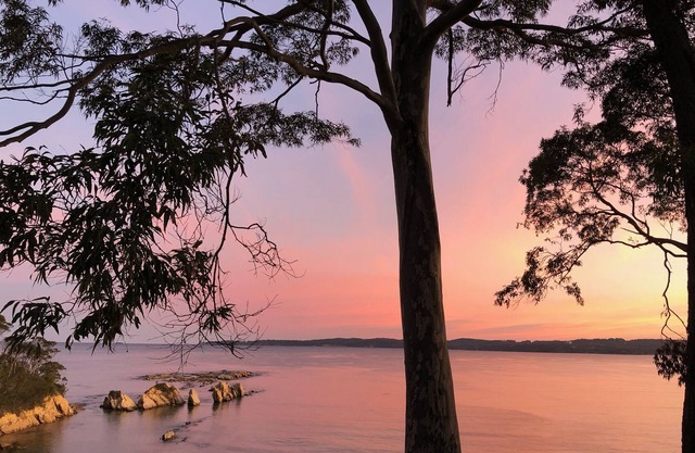 Relax at this cliff top retreat overlooking Long Beach.