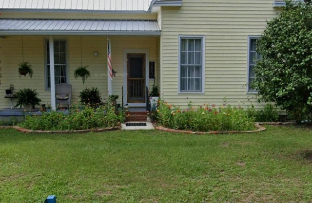 Relax on front porch rockers or back screen porch and deck. shady back yard. .