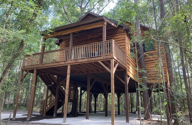 Relax with a view from above in a tree-top getaway! Two Creeks Crossing Resort