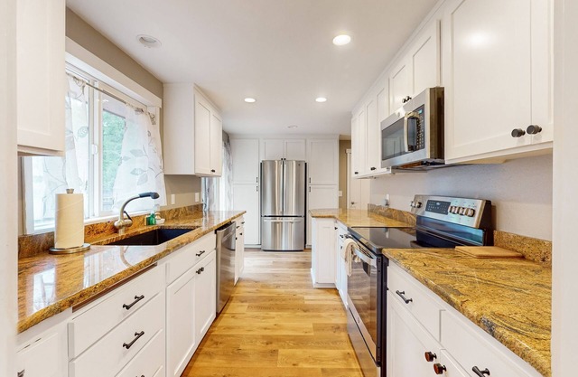 Remodeled home with game room, modern amenities, & golf course views