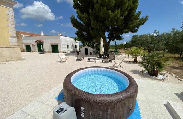 Renovated old farmhouse among olive trees and vineyards with outdoor hot tub