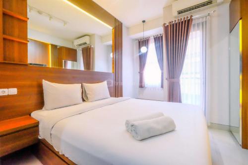Restful and Minimalist Studio Transpark Cibubur Apartment By Travelio