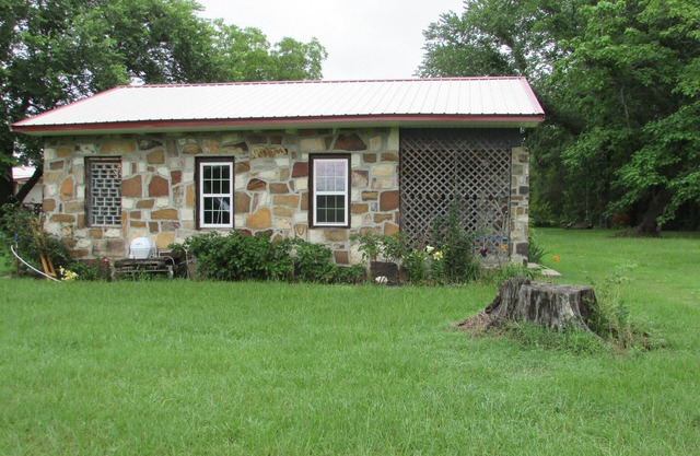 Restored rock house with hot tub and beautiful private deck.