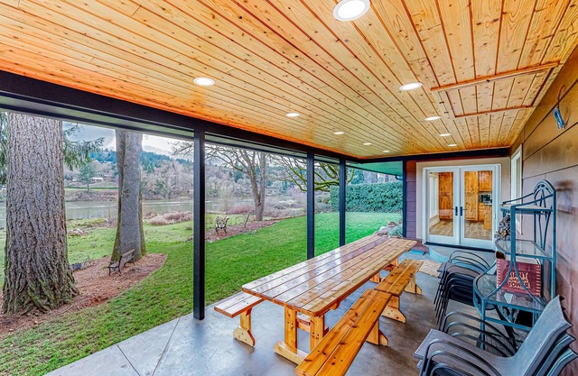 Riverfront all-suite home with amazing views, covered deck, & BBQ