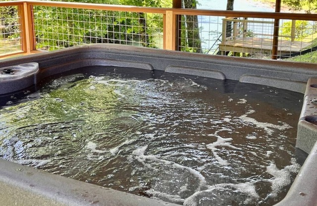 Riverfront Cabin - private hot tub, arcade game, steps to water