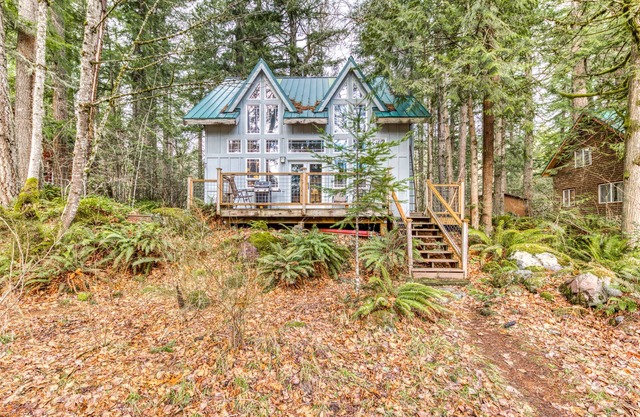Riverfront home close to skiing & fishing with beach access & huge VHS library