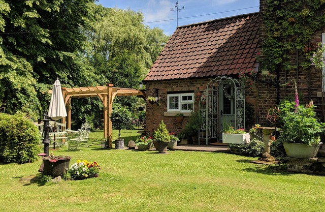 Riverside cottage in a beautiful garden in Lincolnshire.