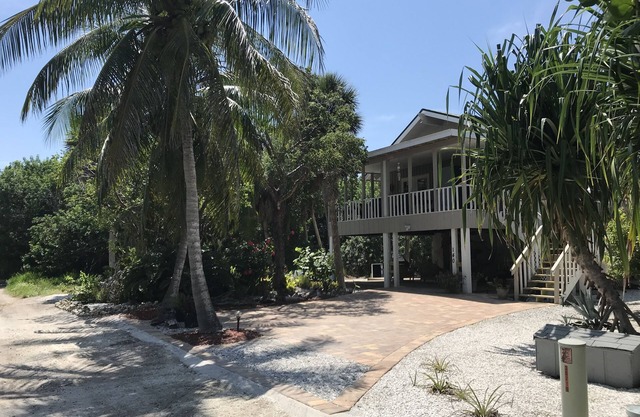 Romantic beach home with golf cart Remodeled Coastal charm