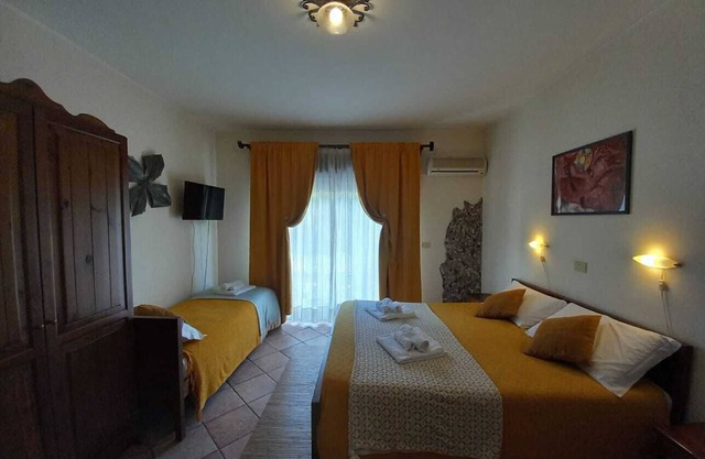 Room 'Family Con Vista' with Balcony, Wi-Fi and Air Conditioning