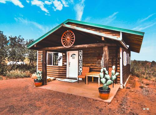 Rustic Cabin Rental with Porch at Foot of Abajo Mountains near Moab, Utah