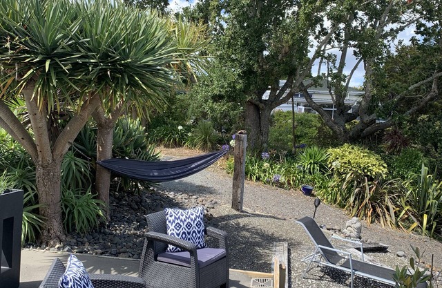 Sea, bush and gardens surround Mason Lane Apartment