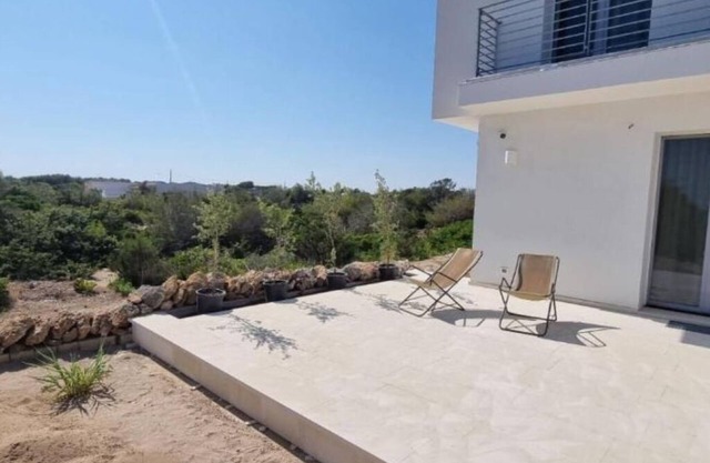 Seafront Juniper apartment with large veranda, 20m from the crystal clear sea.