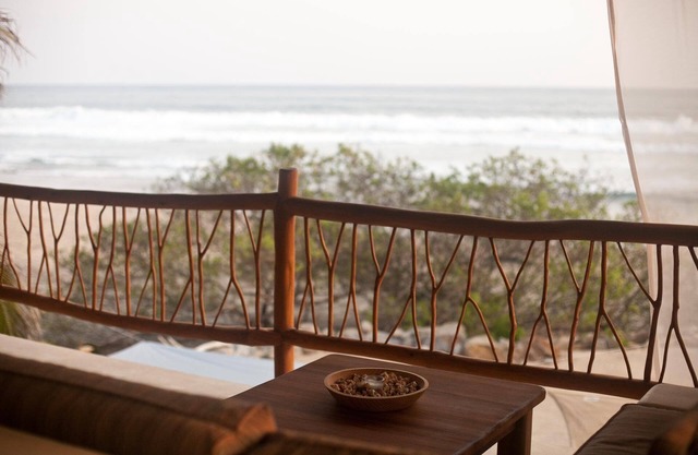 Secluded beachfront 1BR+ with panoramic ocean views & sandy swimming beach