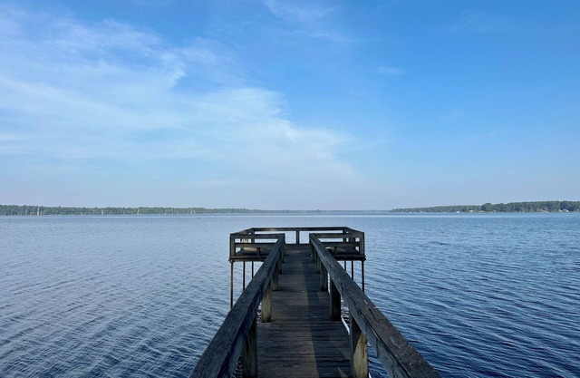 Secluded getaway with lakefront views. Spacious covered deck and dock access.