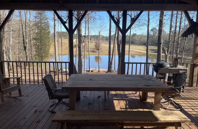Secluded & Private Cabin situated over stocked pond.