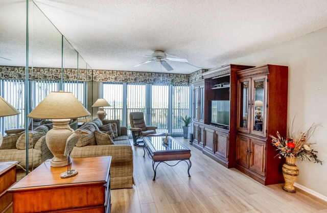 Second-floor condo with pool and tennis court, private W/D, and central AC