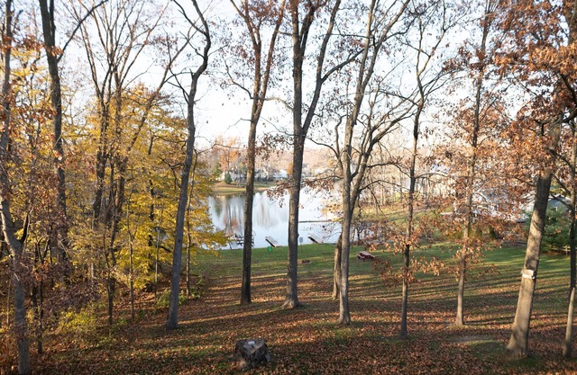 Second floor condo with views of the lake, walking trails & shared garage