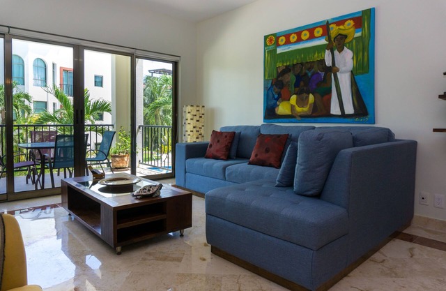 Second Floor Unit with views of the gardens and pool at Paseo del Sol by BRIC