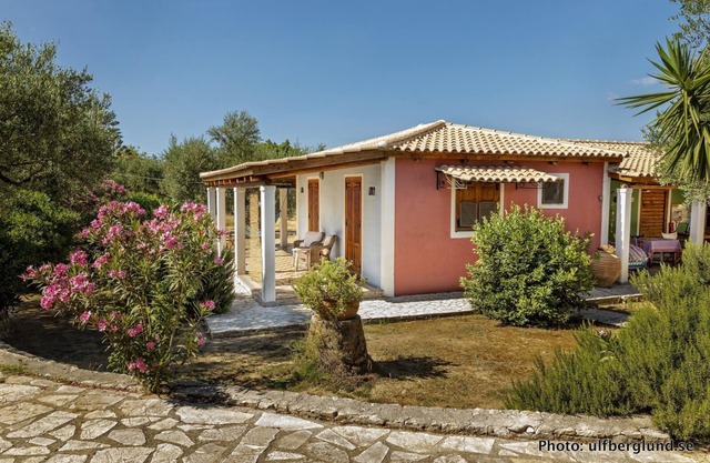 Self catered cottage with large veranda and garden with hammock near the beach.