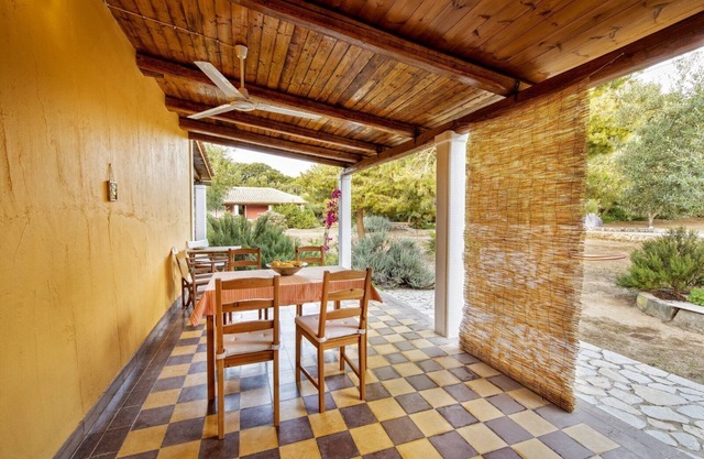 Self catered cottage with large veranda and garden with hammock near the beach.