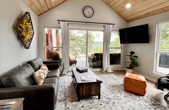 SHORT WALK TO WATER & NESTLED IN THE TREES THIS BEAUTIFUL CABIN HAS LAKE VIEWS