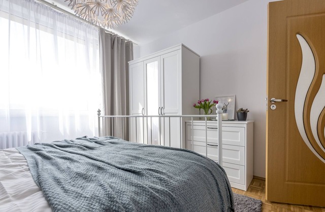 Simple white top floor apartment close to old town