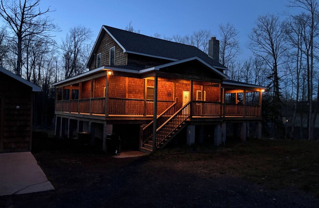 Six bedroom home with a hot tub, pool and an outdoor bar on a two acre lot.