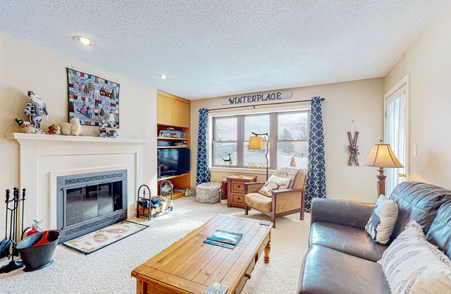 Ski-in/out condo with mountain views, fireplace, pool, & hot tub