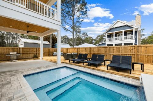 Sleeps 34 2 Homes Private Pools Firepit Golf Cart Walk to Beach Seagrove San Juan by AvantStay