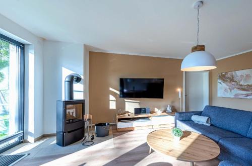 Sonnengruß - Stilvolles Apartment mit Balkon, Kamin & Wellness-Flair am Krakower See