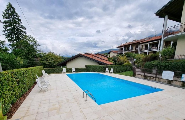 Spacious 4 bedroom house with fireplace in a well maintained residence with pool