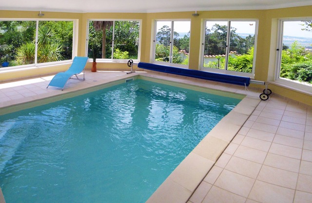 Spacious 5 Bedroom villa. Heated indoor pool. Unlimited WiFi. Cable TV.
