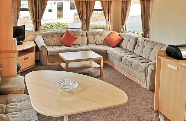 Spacious and comfortable 12ft-wide caravan with one double and two twin.